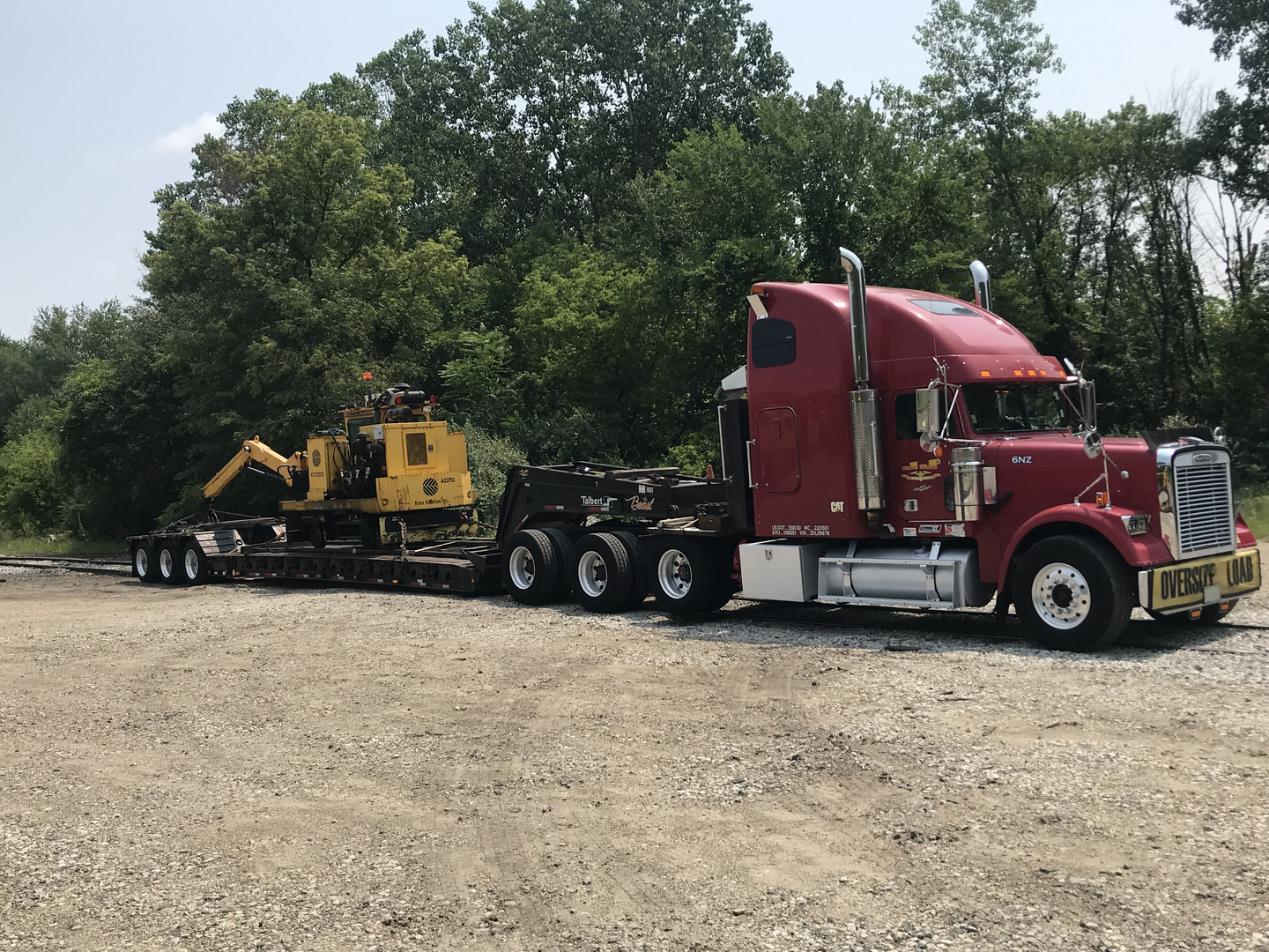 Heavy haul dispatcher managing high-paying freight for drivers